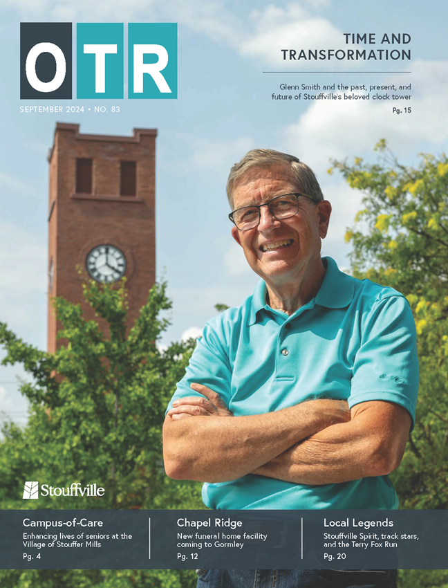 cover of on the road magazine with man in front of clock tower