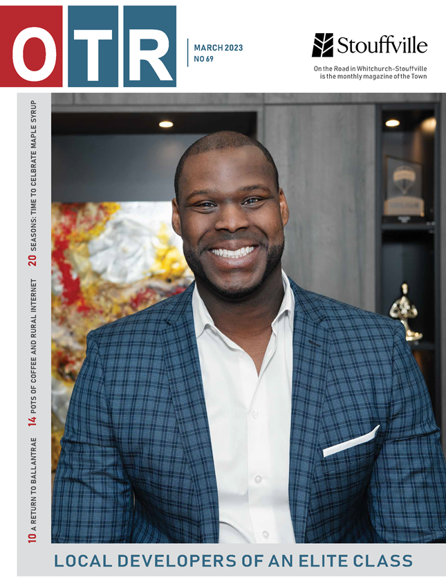magazine cover with man in blue sports jacket smiling