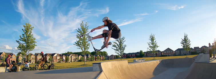 skateboarder using skate park